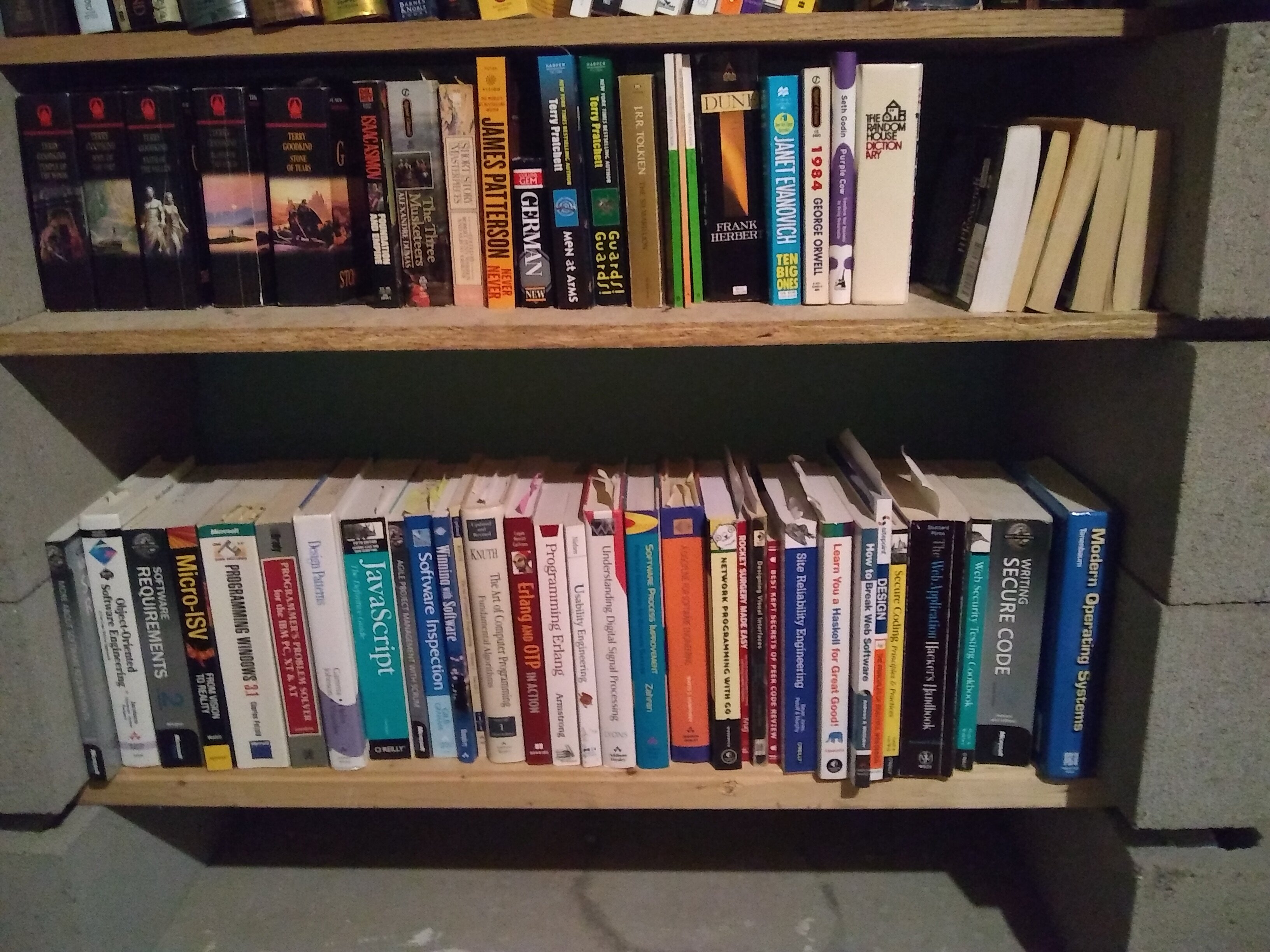 A slice of my library, including the “temporary” shelving solution. What’s on your shelf?